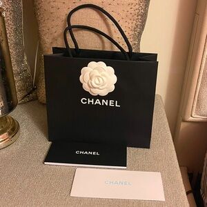 Authentic Chanel shopping bag,2 bucks & flower.